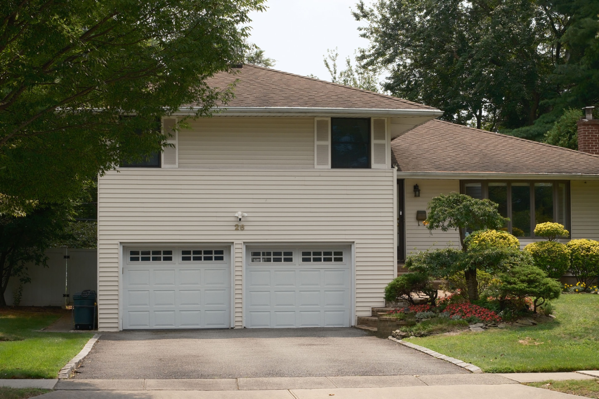 Garage doors on a residential home in a welcoming neighbourhood