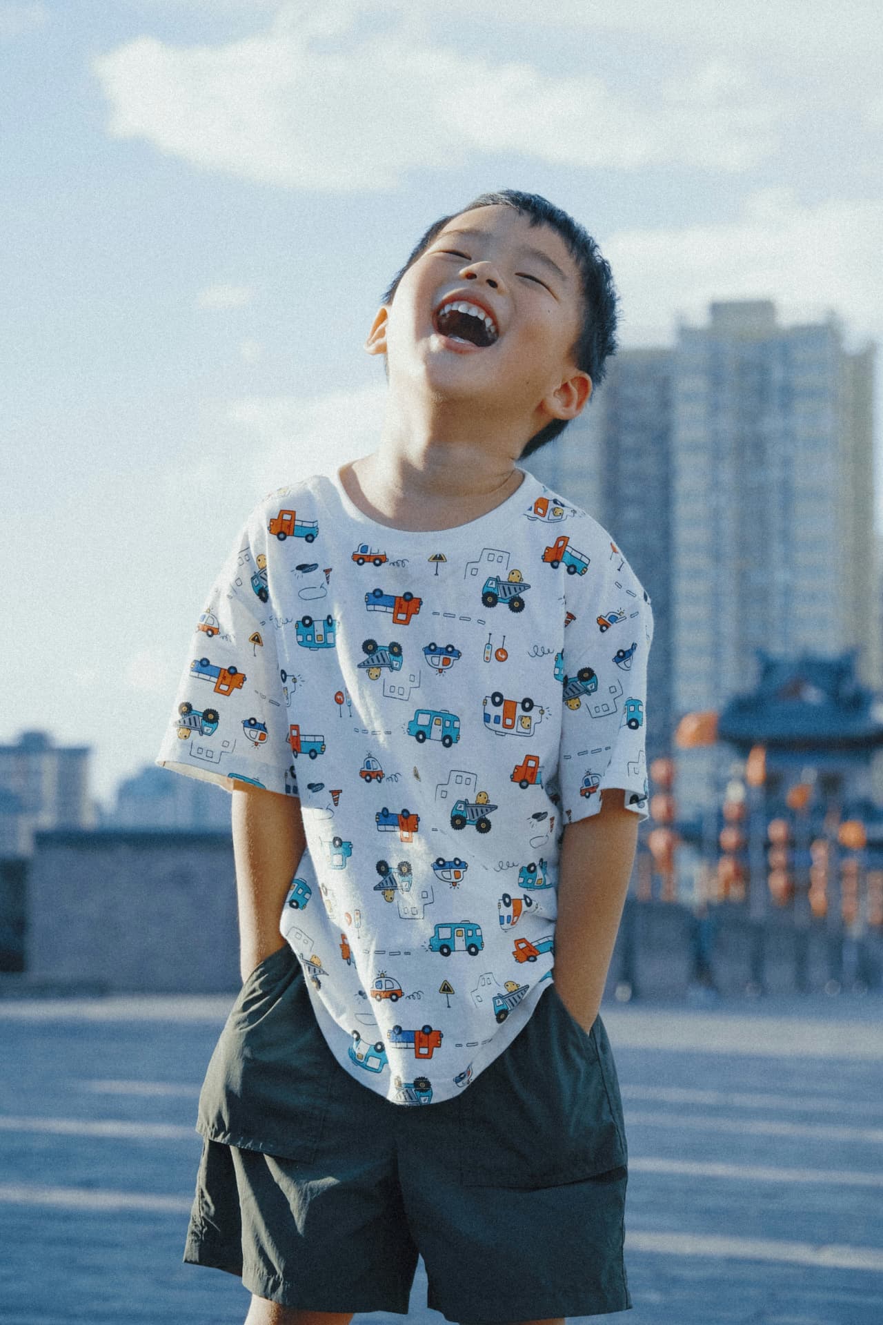 A happy child laughing outdoors